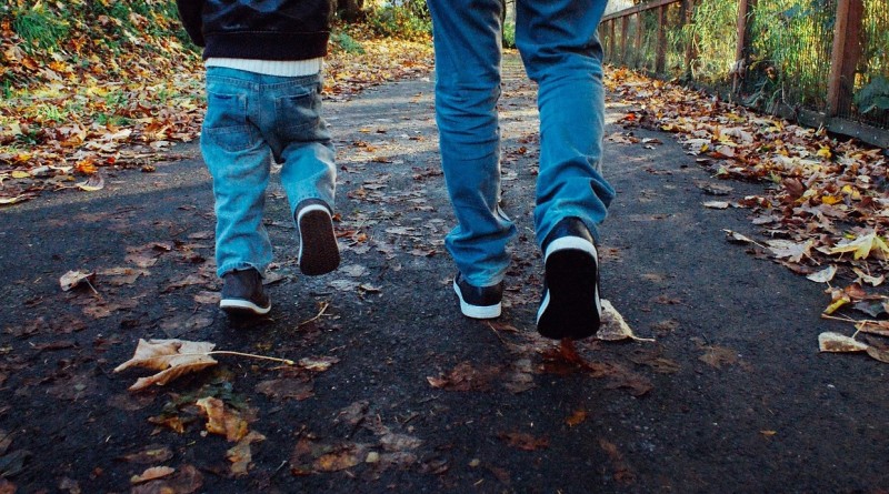 Man and boy walking